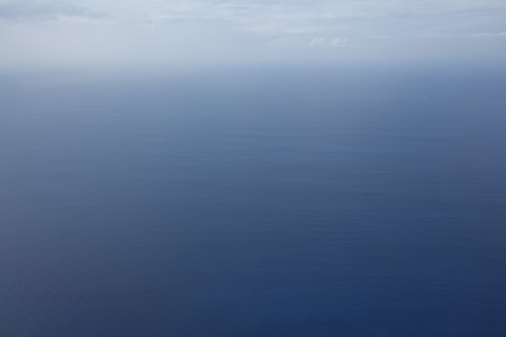 body of water under cloud