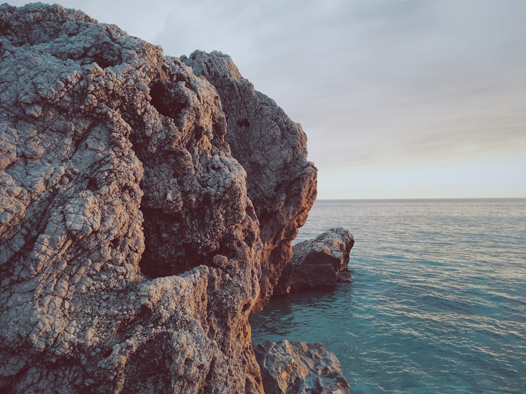 rock forming near body of water