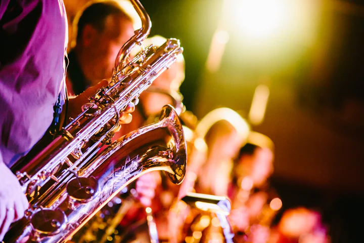 Jazz musician playing trumpet in a dim club