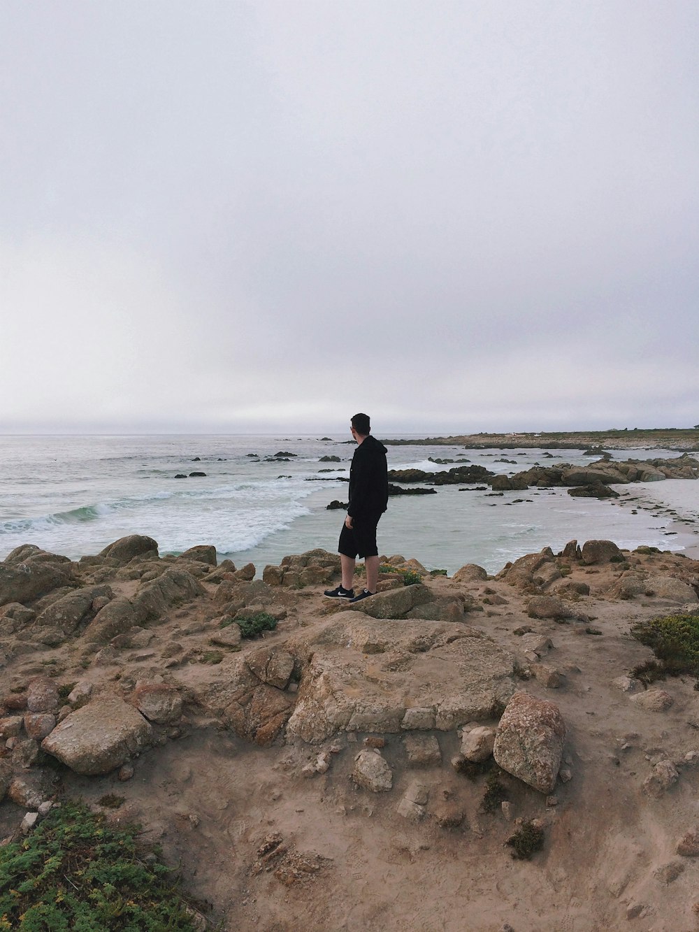 man walking in the beach