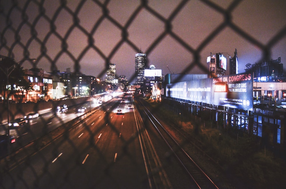 time lapse photography of vehicles on roadway at night time