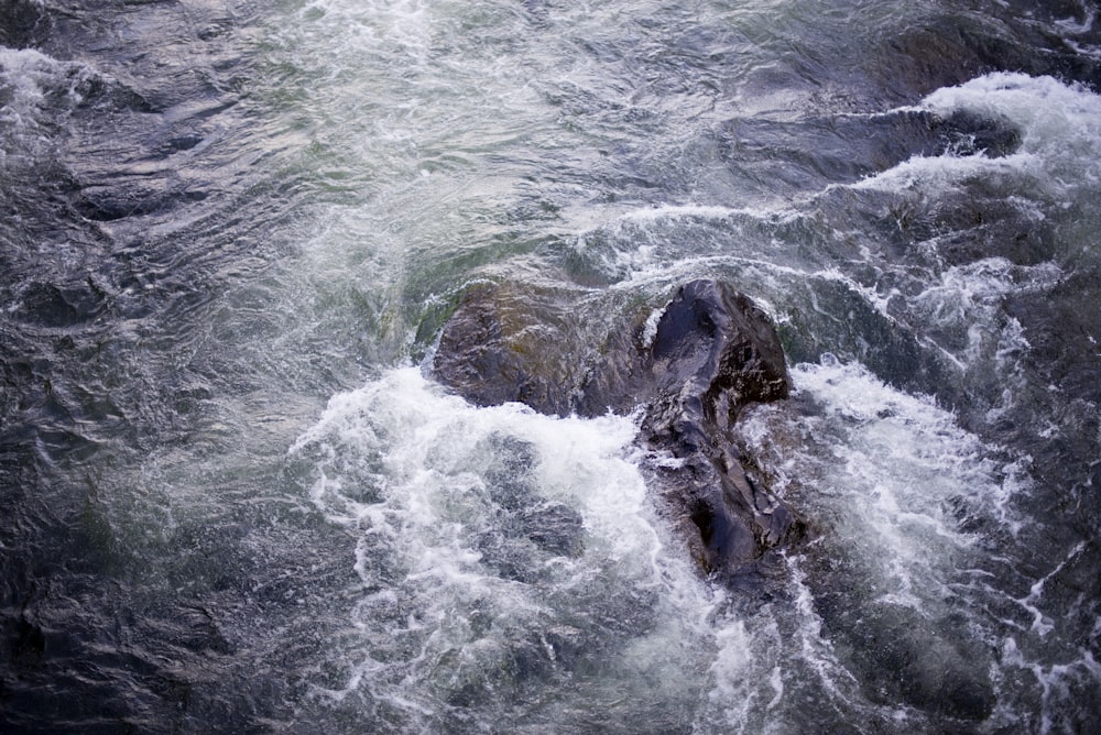 aerial photography of coastal rock with big waves