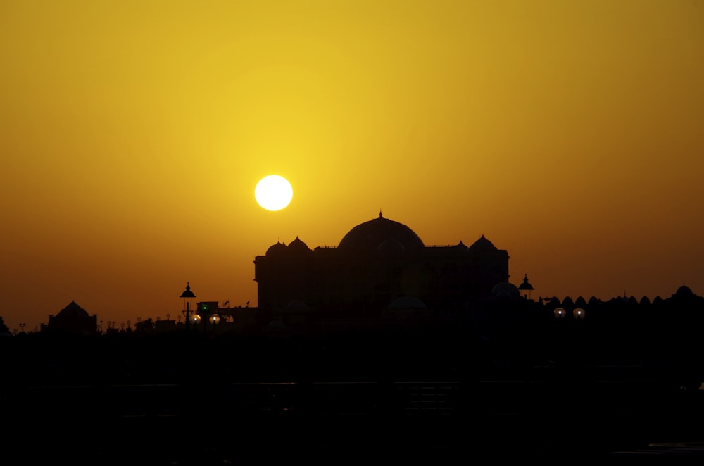 silhouette of dome building during golden hour