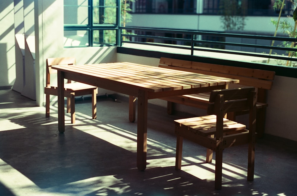 table and bench near window