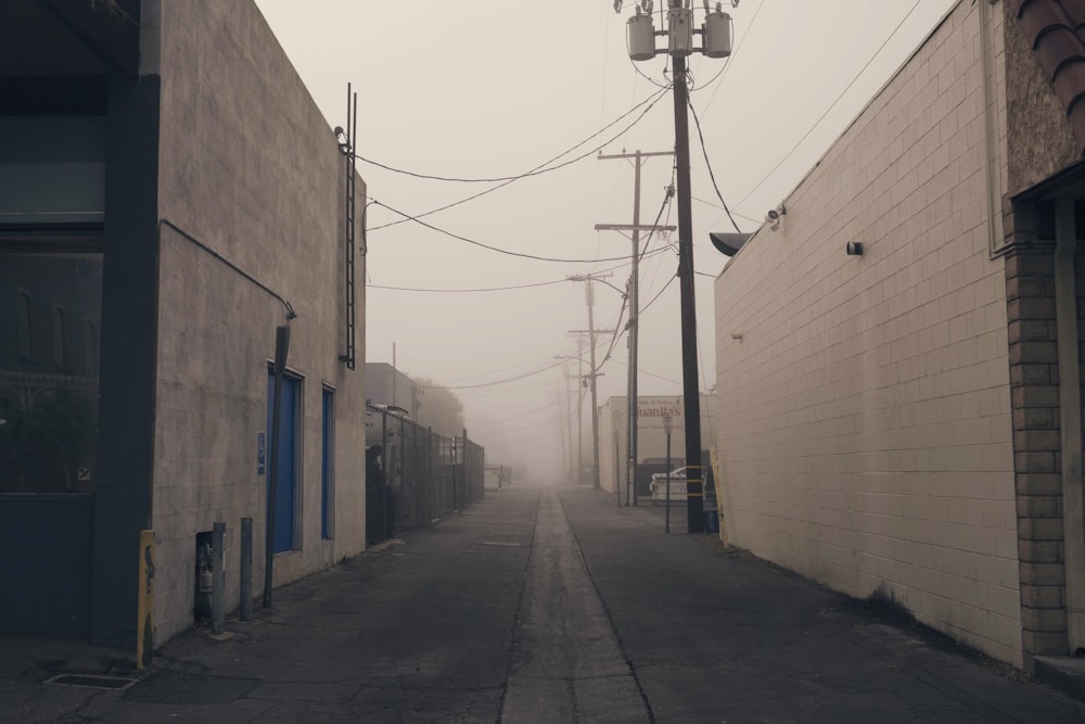 gray concrete road under white sky at daytime