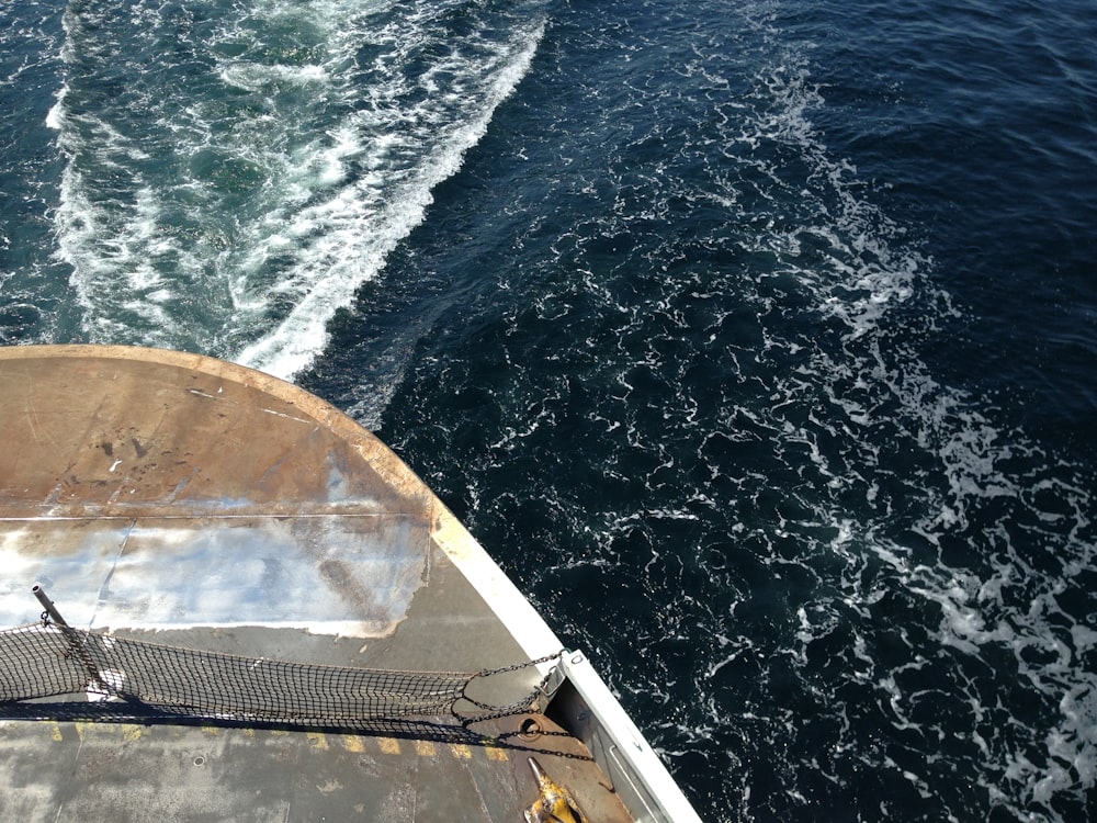 a boat traveling across a body of water