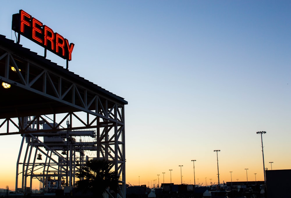 Ferry neon light signage under blue sky