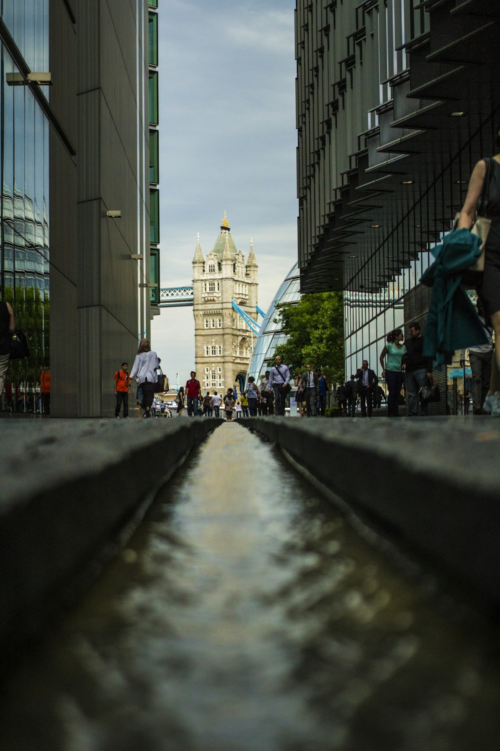 worm's-eyed view of pathway between concrete buildings