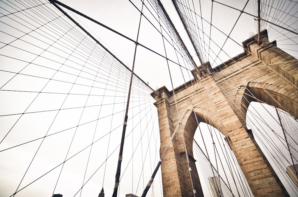 cable bridge under white sky