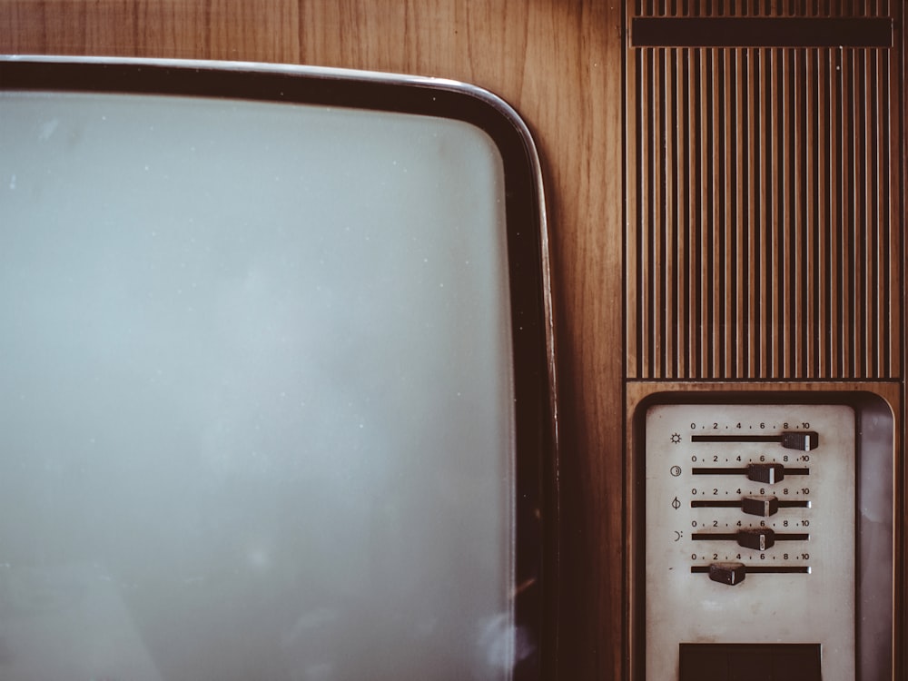 an old fashioned television set with a white screen