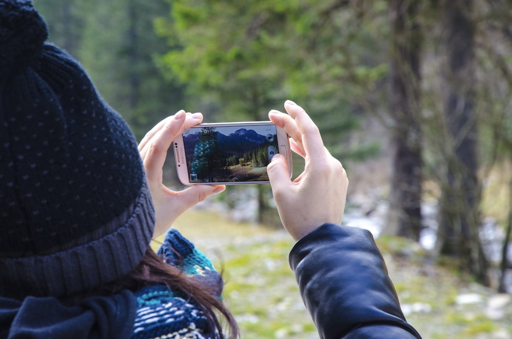 person holding silver Samsung smartphone