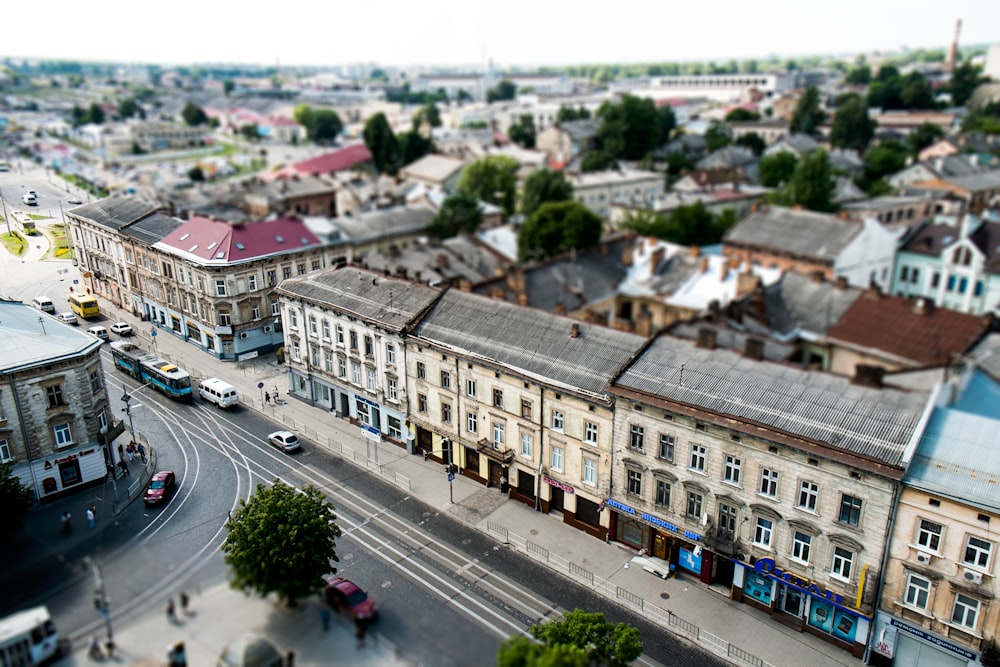 high angle view of cars on road between buildings