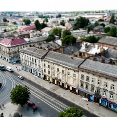 high angle view of cars on road between buildings