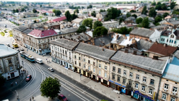 high angle view of cars on road between buildings