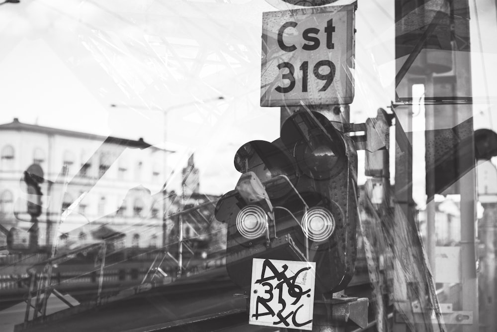 grayscale photo of stop light at daytime