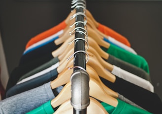 assorted-color hanged shirts with hangers