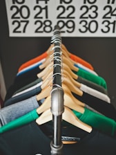 assorted-color hanged shirts with hangers