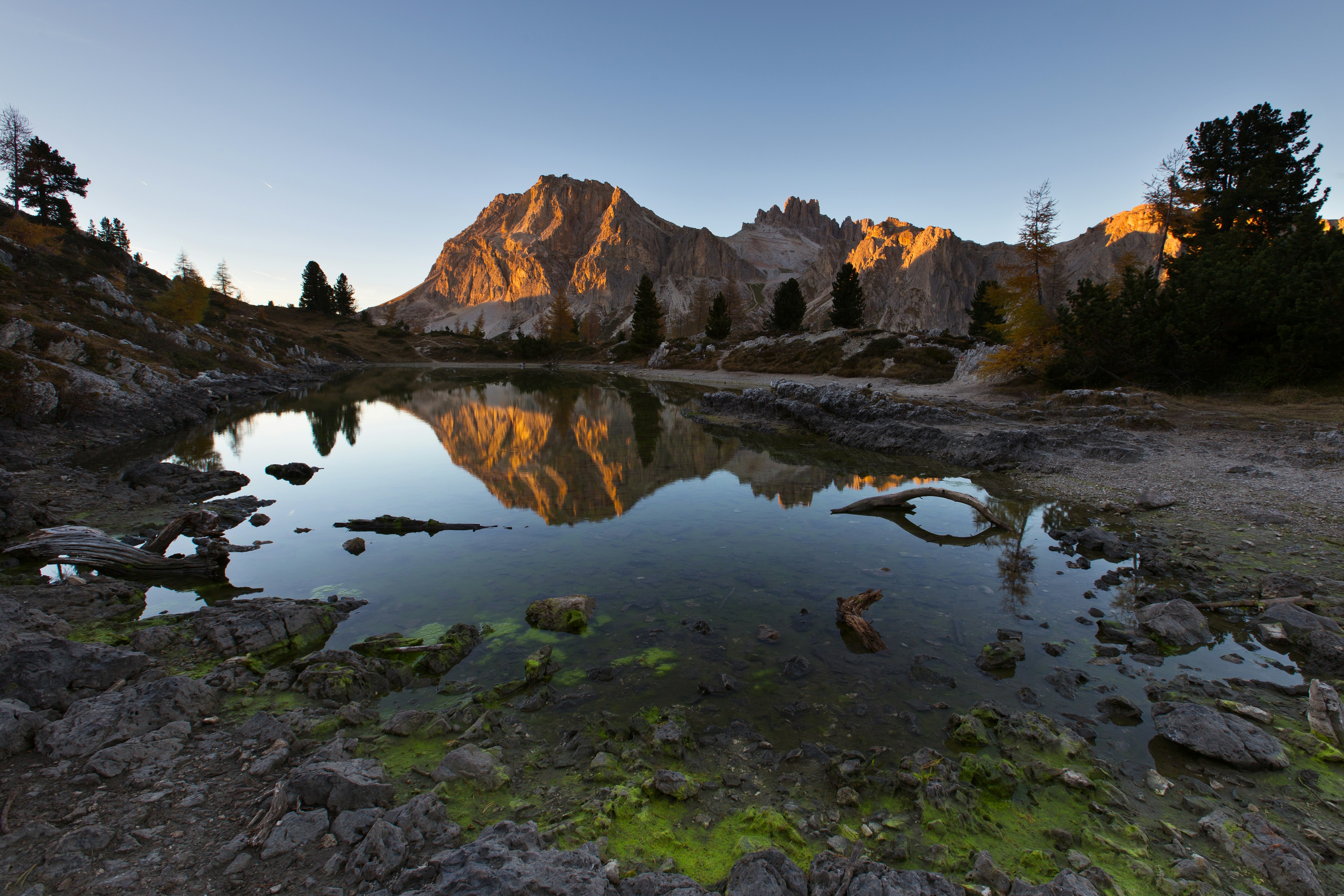 water mirror reflection of mountain during golden hour