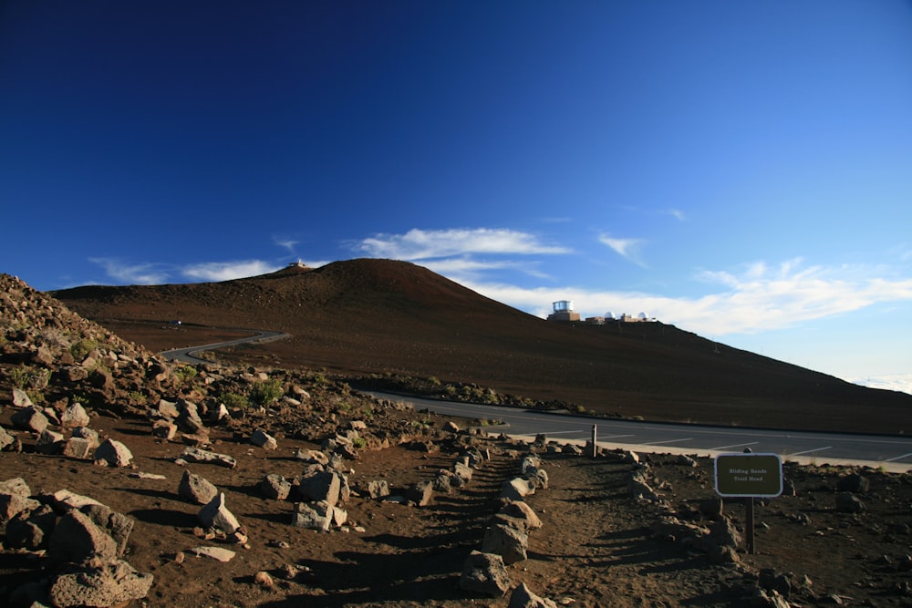 photo of mountain near road during daytime