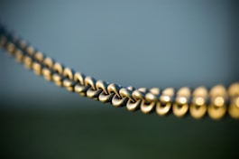 tilt shift photography of gray steel chains