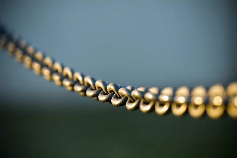 tilt shift photography of gray steel chains