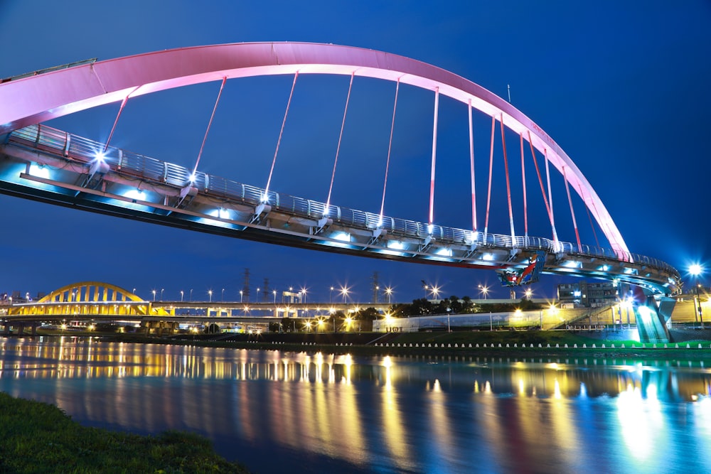 pink steel bridge during night