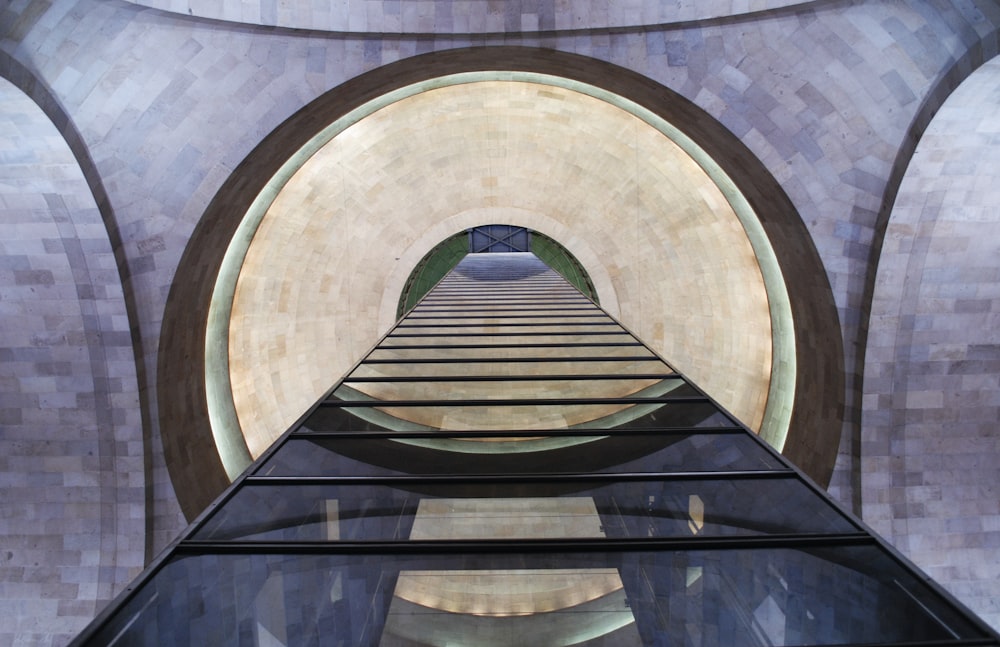 a view of a walkway through a tunnel in a building