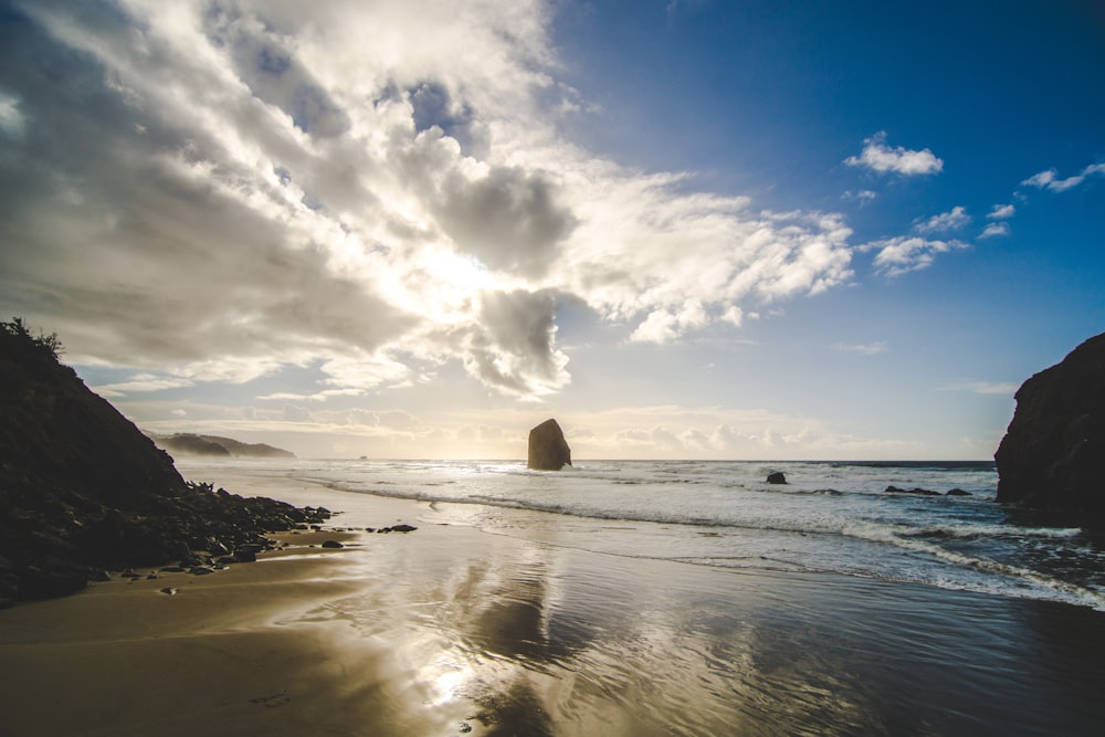 sea with cliffs during daytime