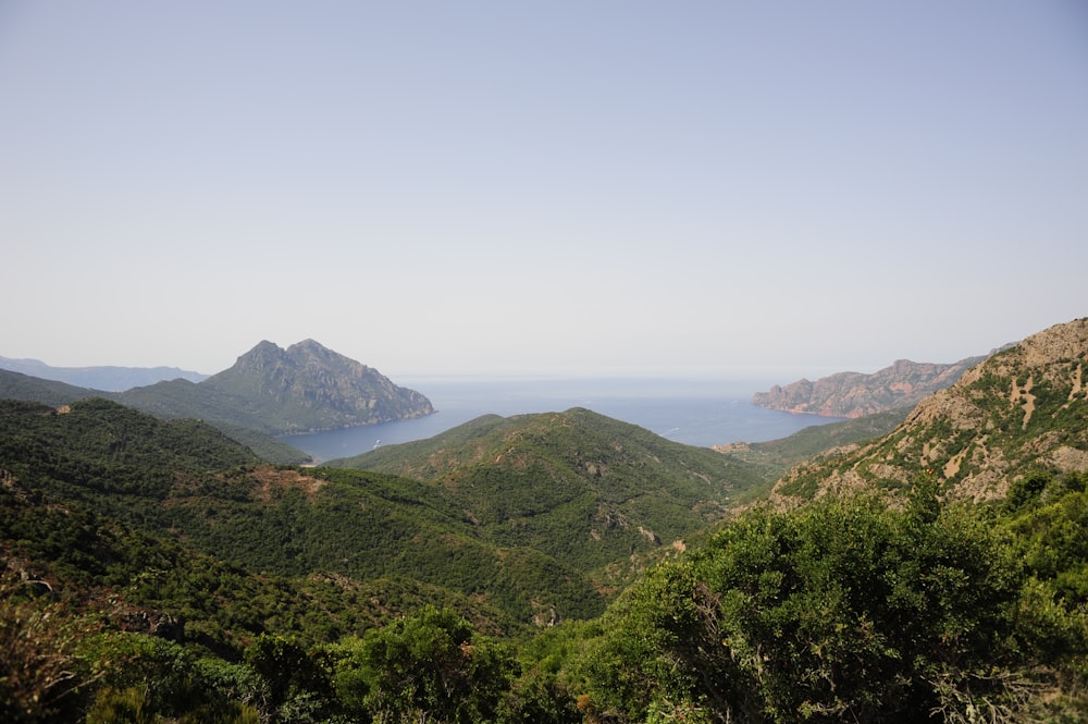 body of water near mountains