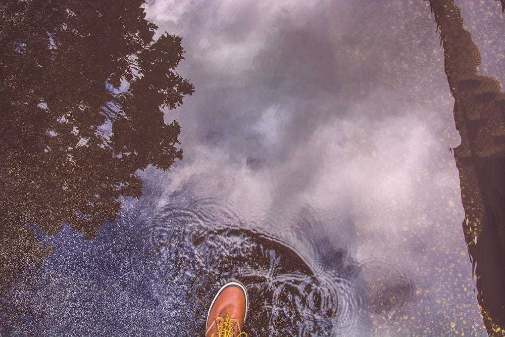 person stepping on water