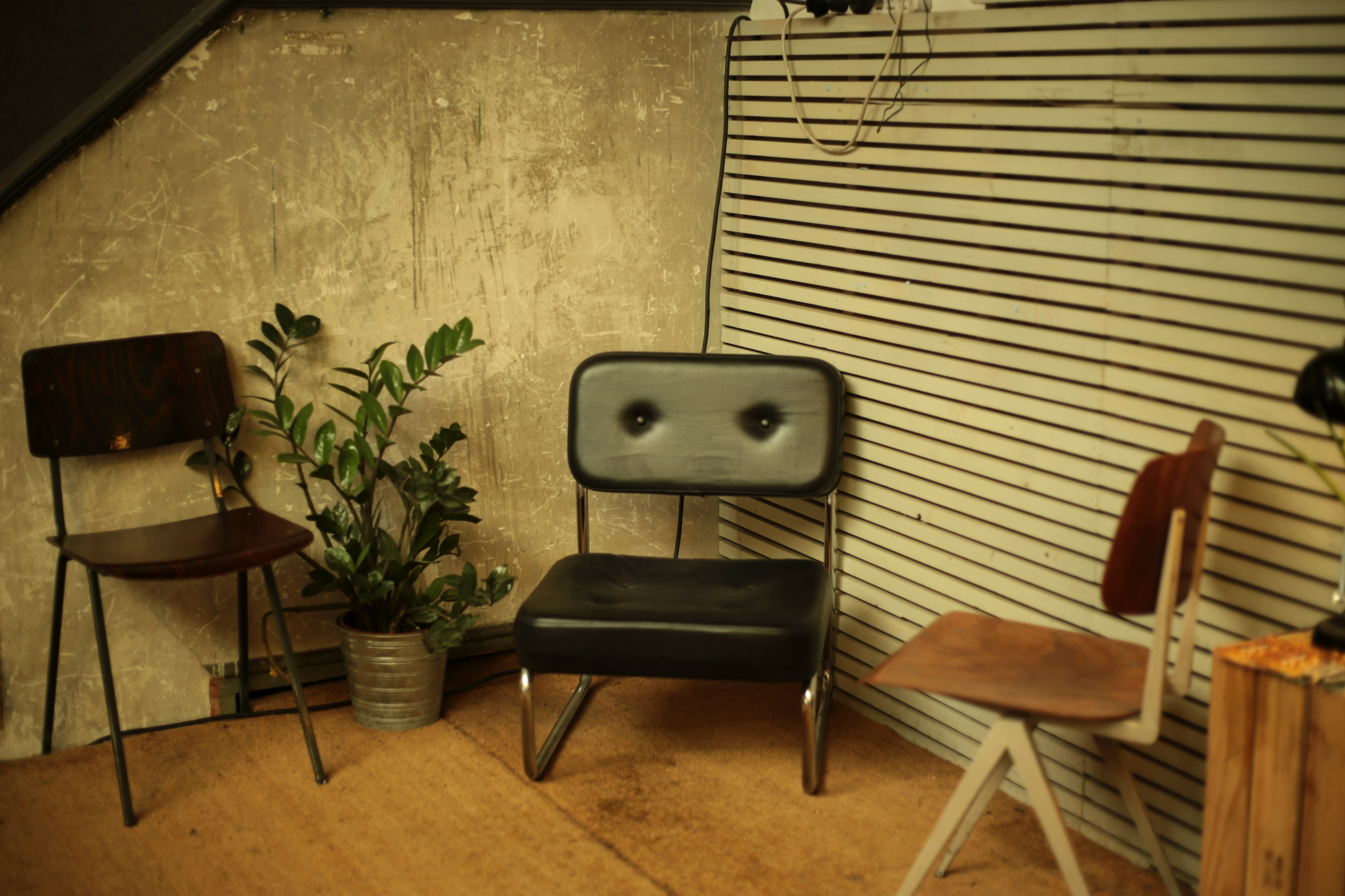 two brown and black chairs on brown wood flooring