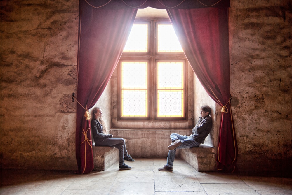 woman facing man in room