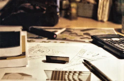 A clean, modern workspace with construction blueprints and tools neatly arranged.