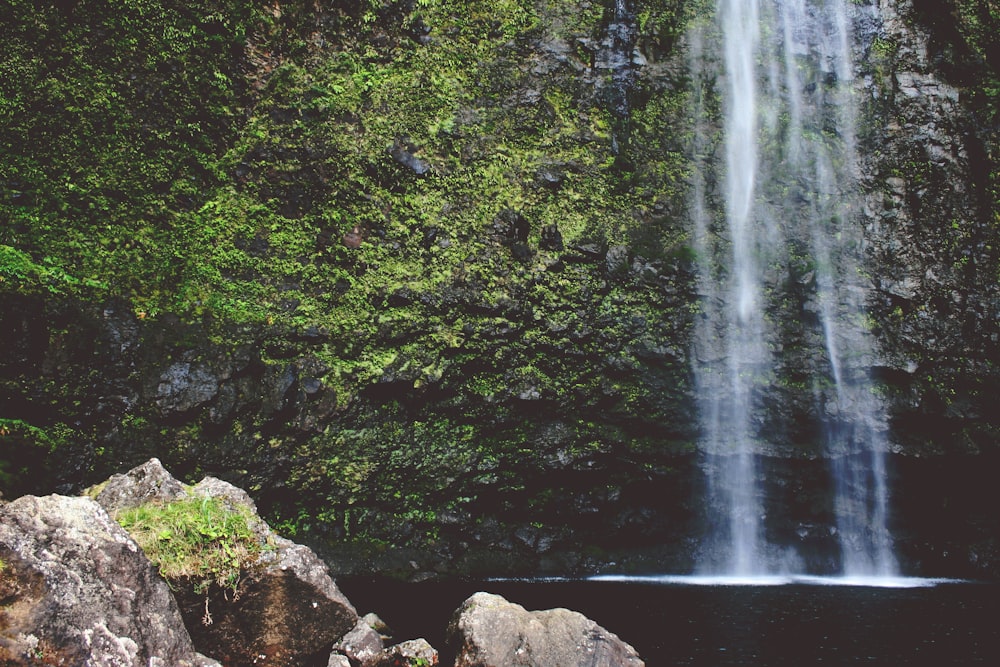 rock near waterfall