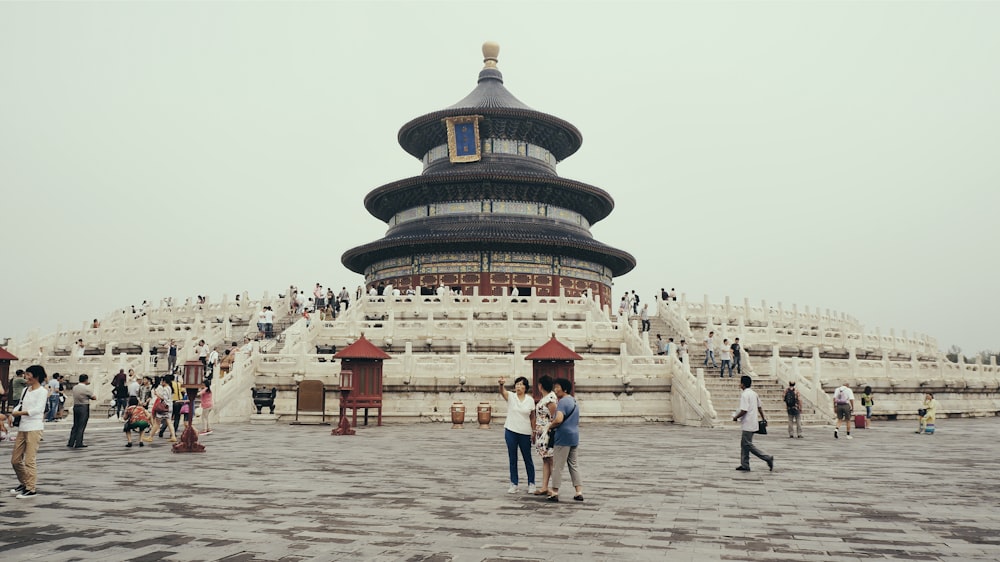 people near temple during day