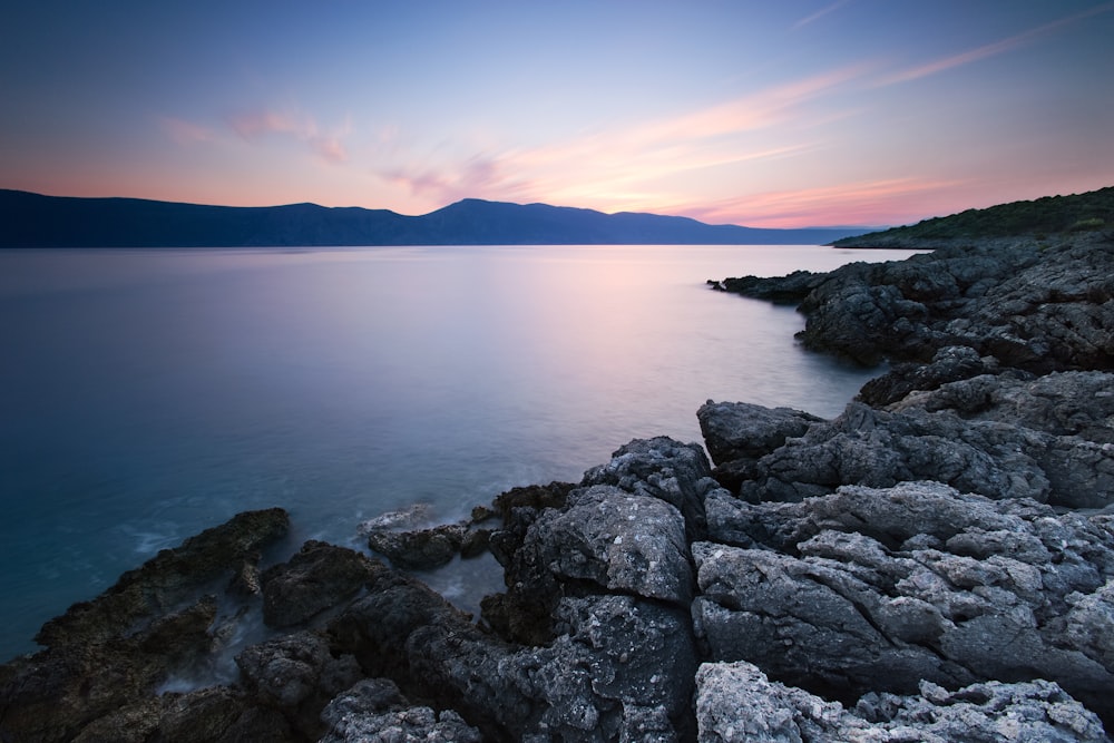 gray rock formation near body water