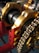 A close-up view of mechanical components featuring a chain and a series of cylindrical parts with golden and red structural elements. The chain is wound around a sprocket, and the parts are supported by a red frame with yellow bolts.