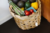 A close-up of fresh organic produce arranged in a basket, highlighting the commitment to healthy living.