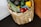 A satisfied customer showcasing a basket of fresh produce.