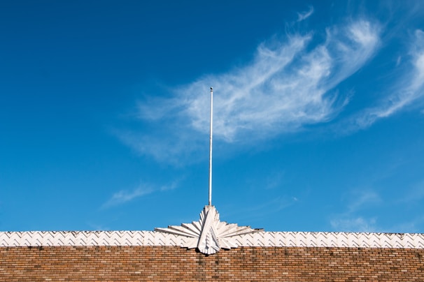 Freshly rebuilt rooftop parapet revealing clean lines and durable masonry materials.