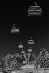 gray scale photo of cable cars