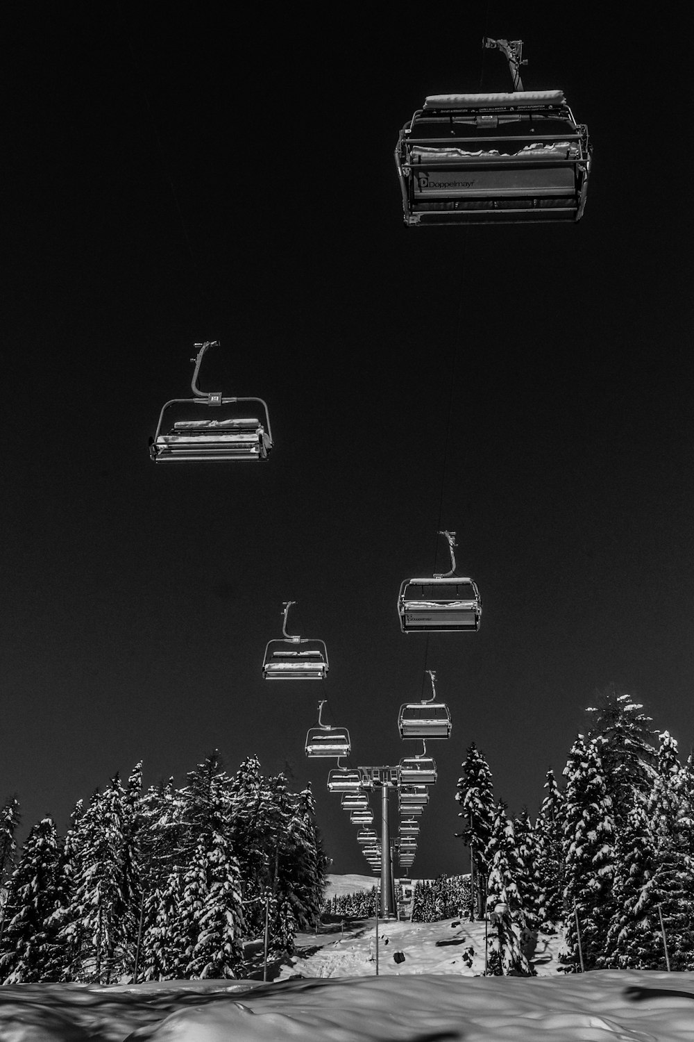 gray scale photo of cable cars