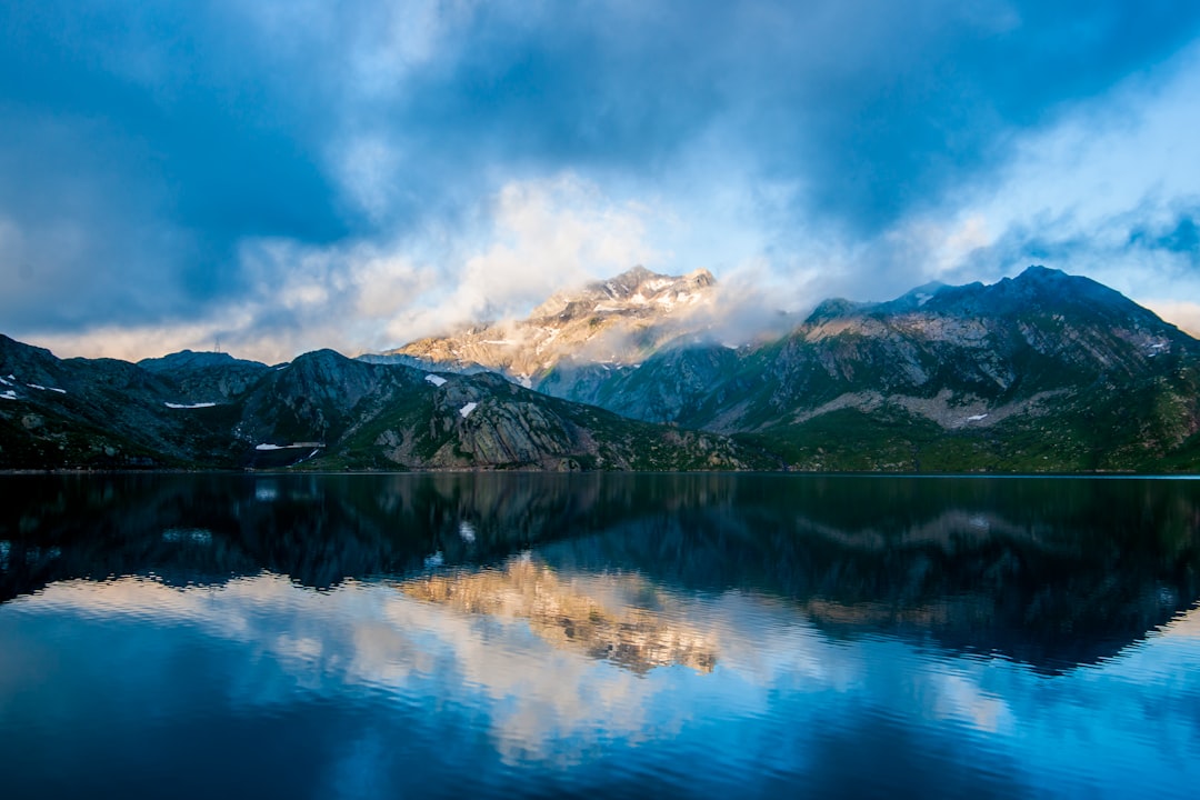 parorama photography of mountain under cloudy sky