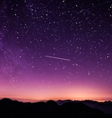 silhouette photo of mountain during night time