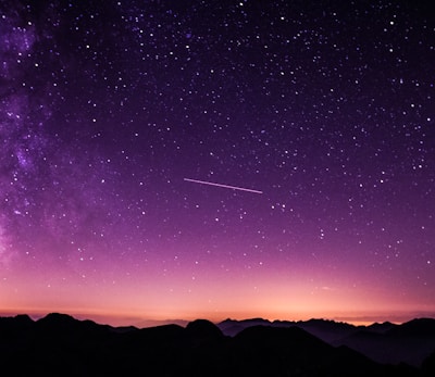 silhouette photo of mountain during night time