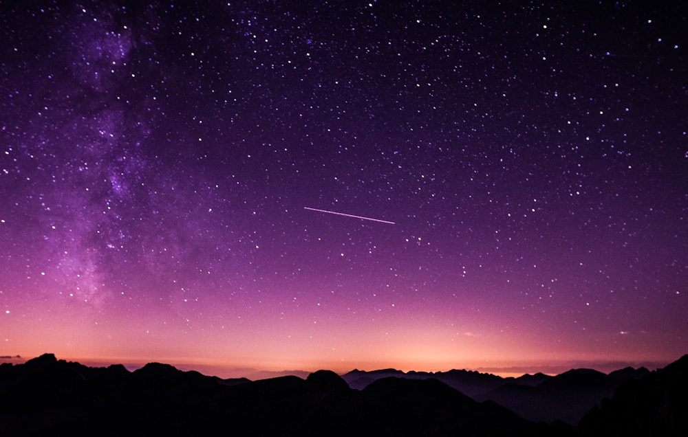 silhouette photo of mountain during night time