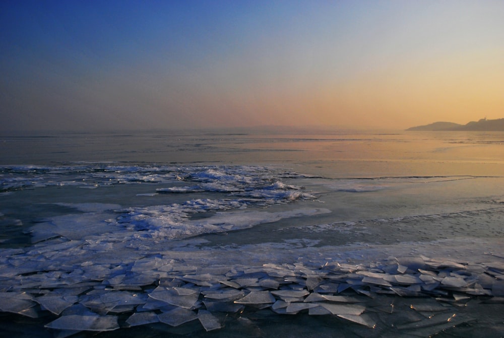 body of water during golden hour