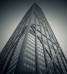 worm's eye-view photography of gray high-rise building