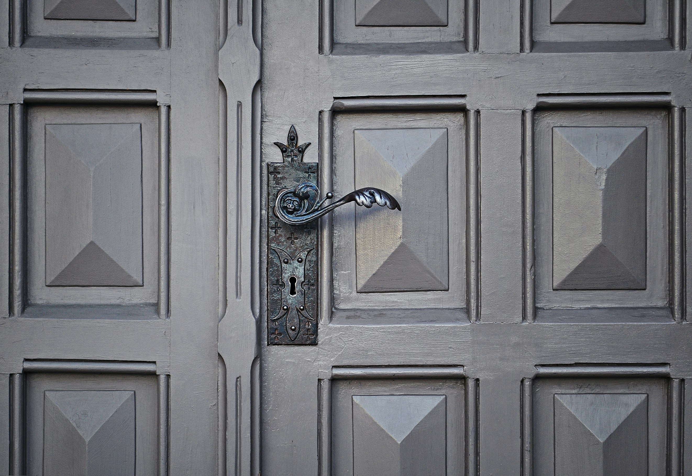 gray wooden door locked closed