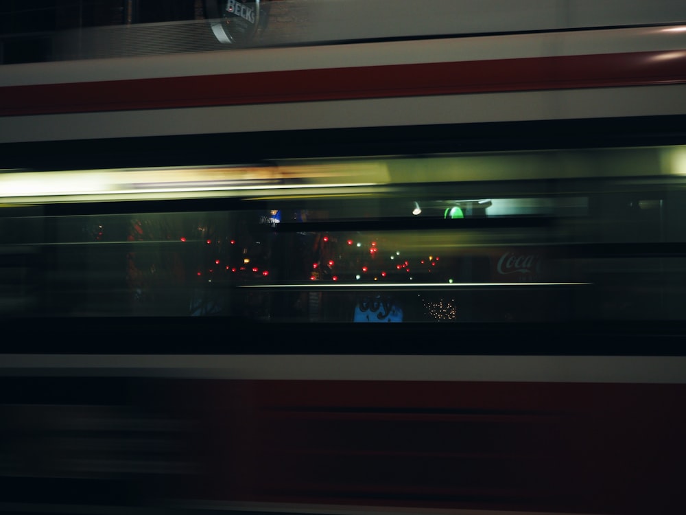 a blurry photo of a train at night